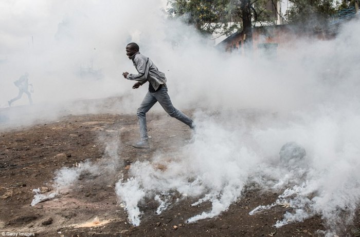 Tear gas fired at opposition supporters in Kenya Kenya police fire teargas break up protests over bloggers death custody